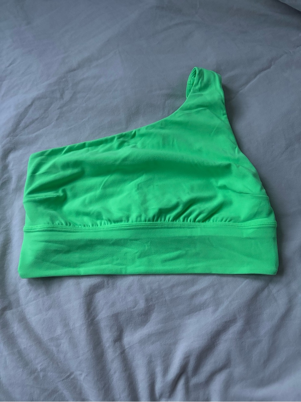 One-Shoulder Women’s Lululemon Sports Bra in Pistachio Green.